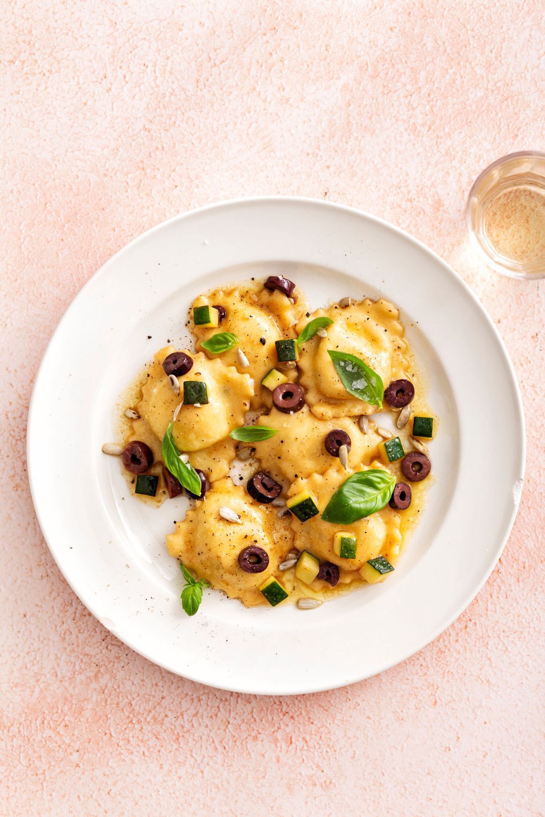 Ravioli with ricotta filling, zucchini and beurre noisette with olives