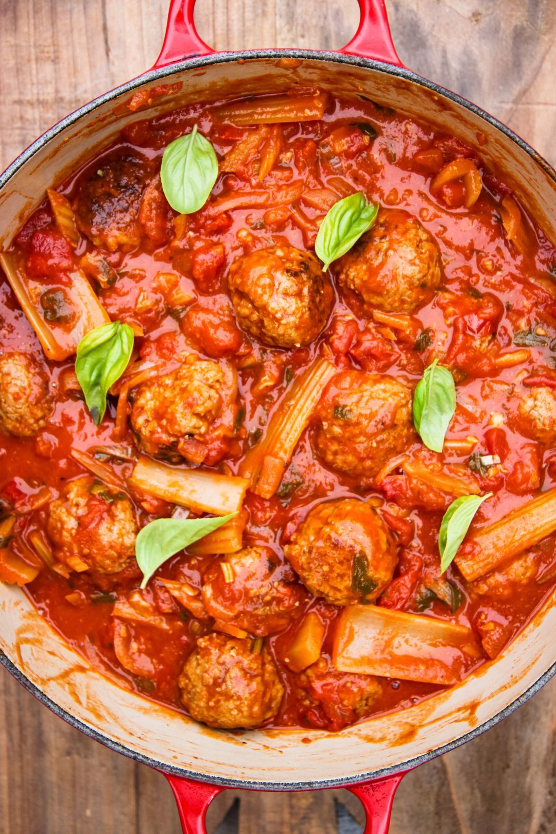 Celery with meatballs in tomato sauce