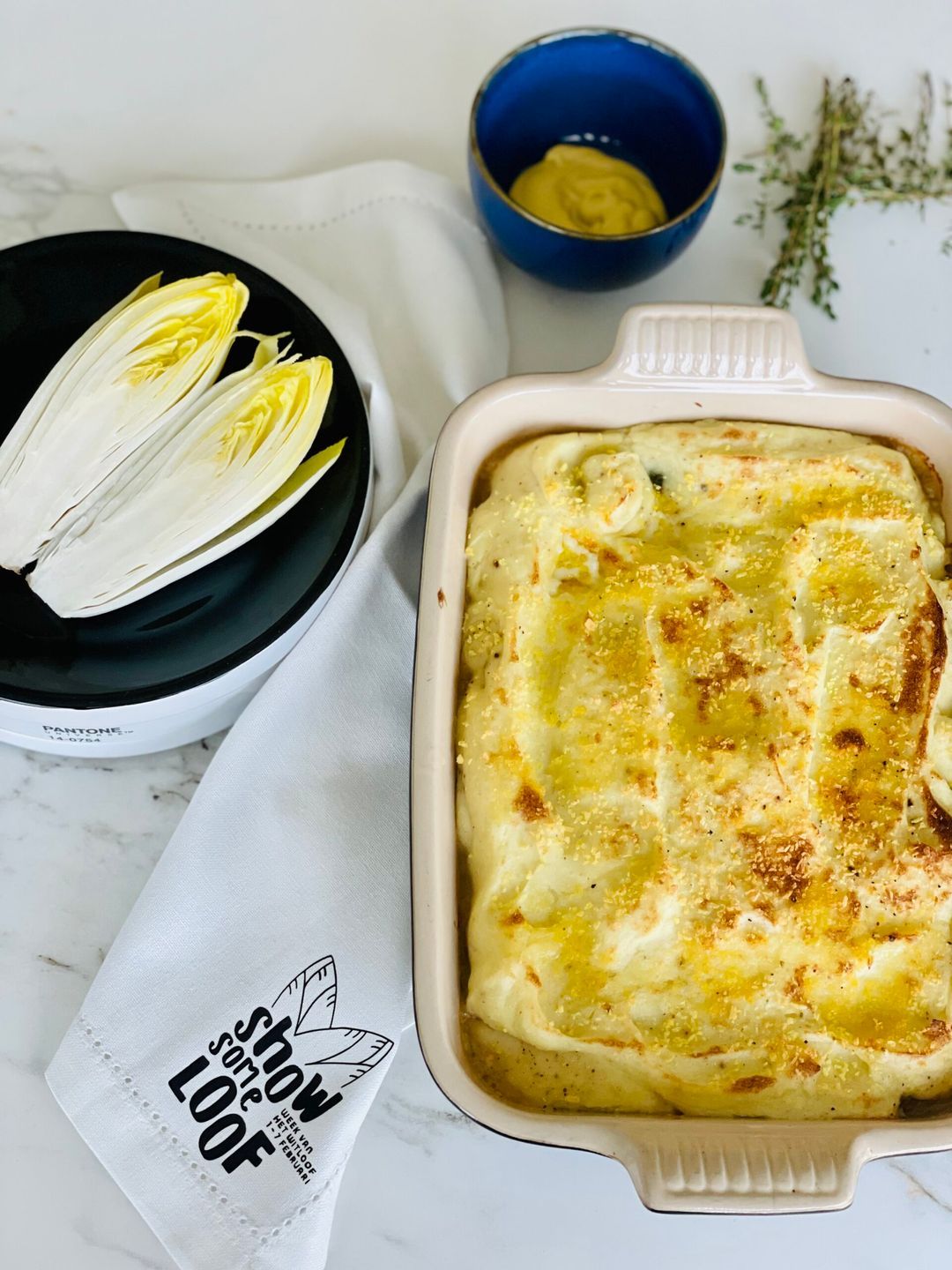 Oven dish with chicory, celeriac puree and minced beef