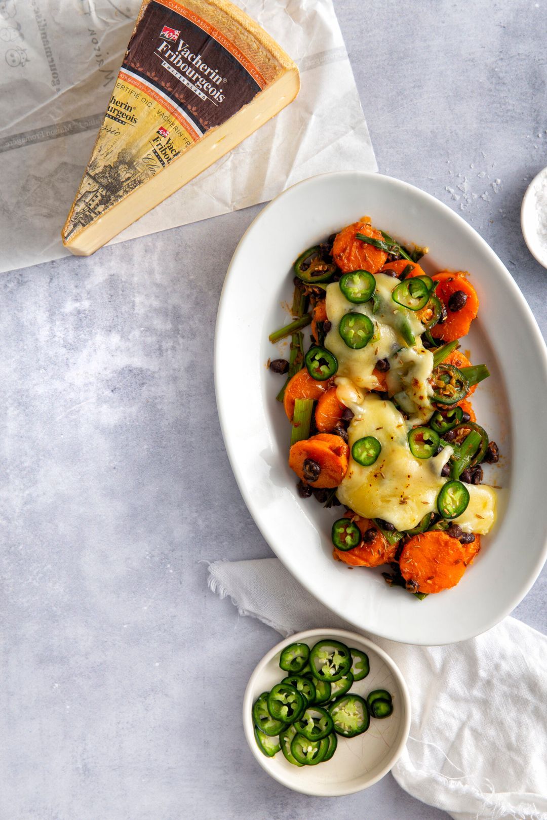 Spicy sweet potatoes with black beans and raclette