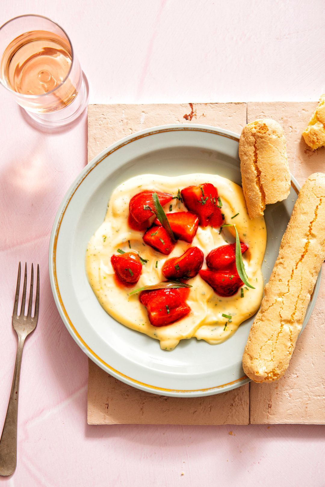 Dragon custard with lady fingers and marinated strawberries