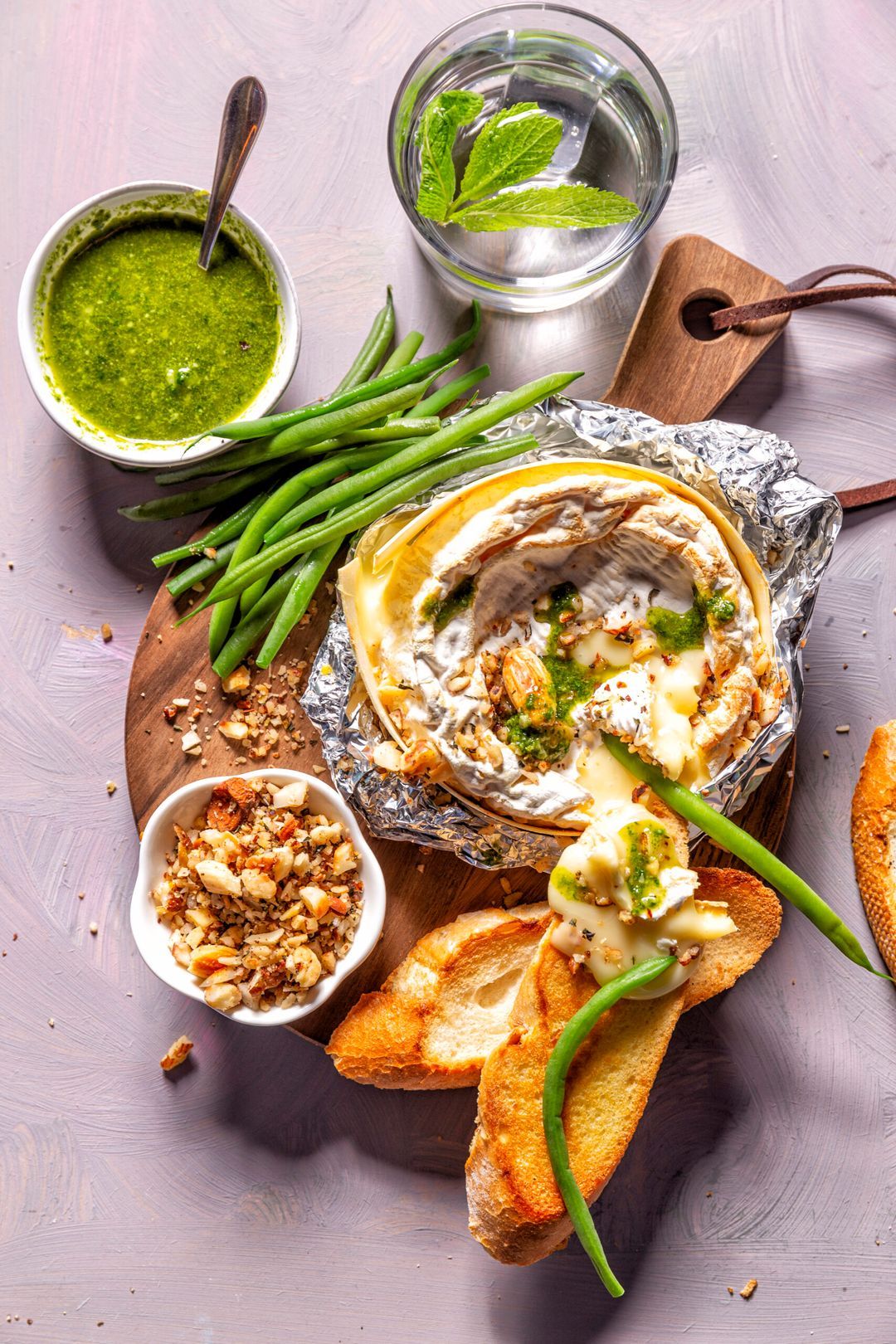 Baked camembert with pistou and nut crumbs