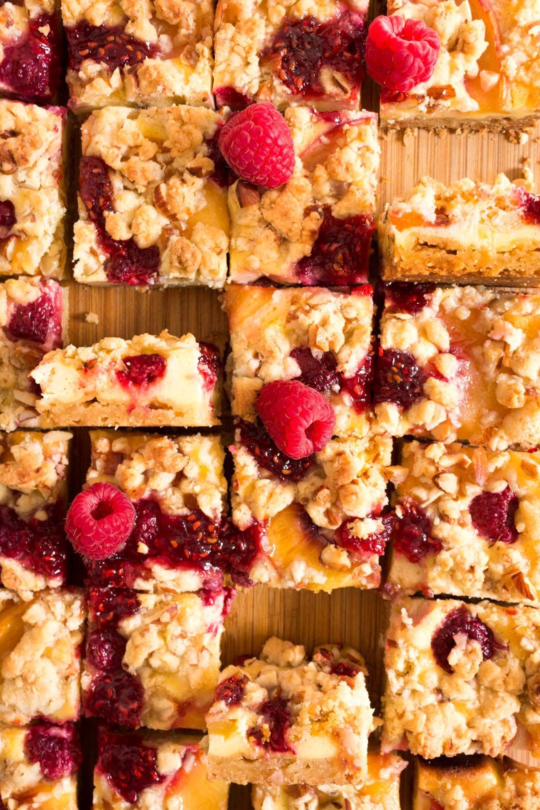 Cheesecake with raspberries, nectarine and streusel