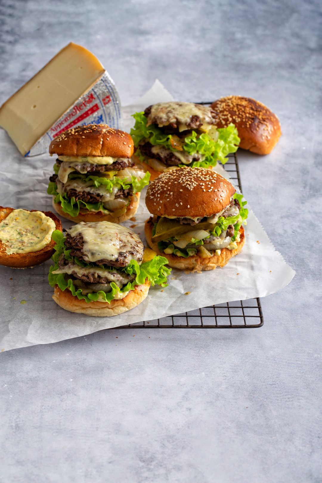 Double raclette burger with braised onions and Appenzeller