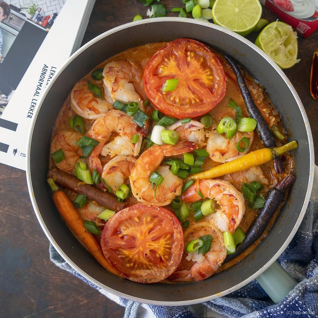 Scampi in whiskey with roasted tomato