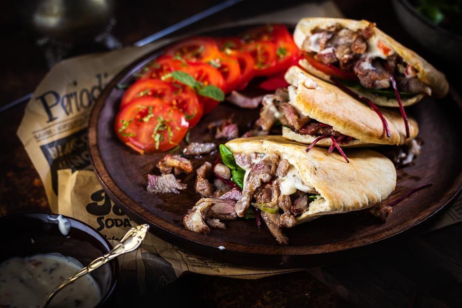 Making doner kebab with black garlic sauce on the bbq - bbq bastard