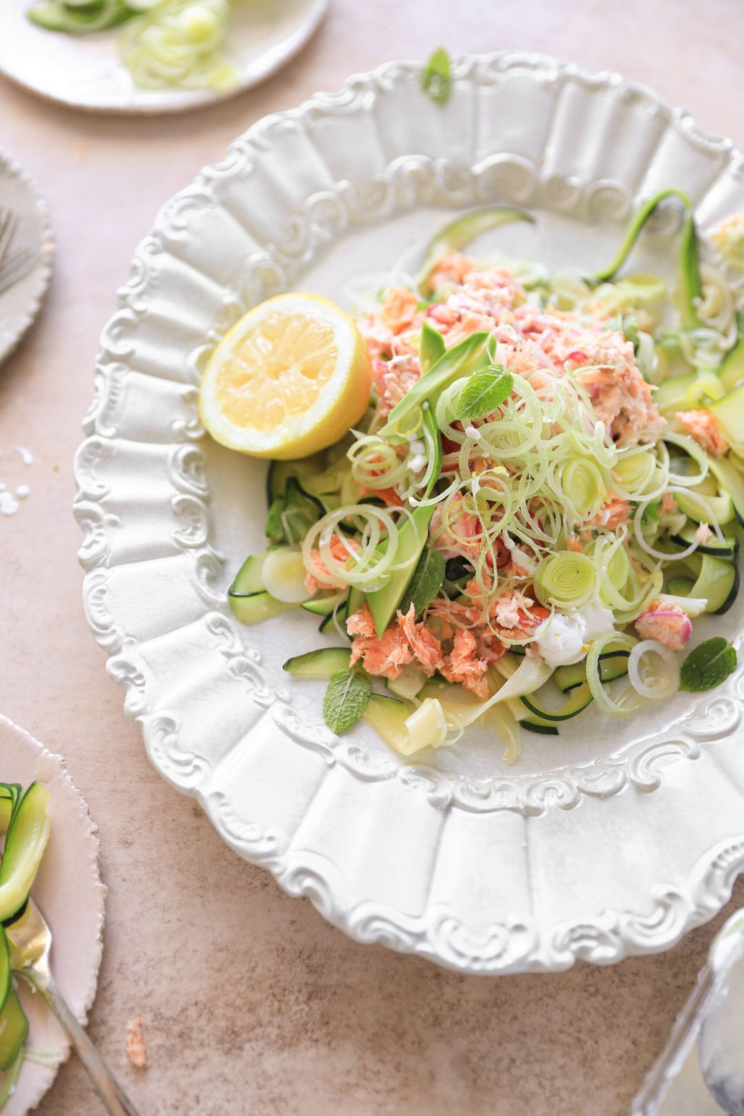 Zucchini with salmon, lemon cream sauce, avocado & leek