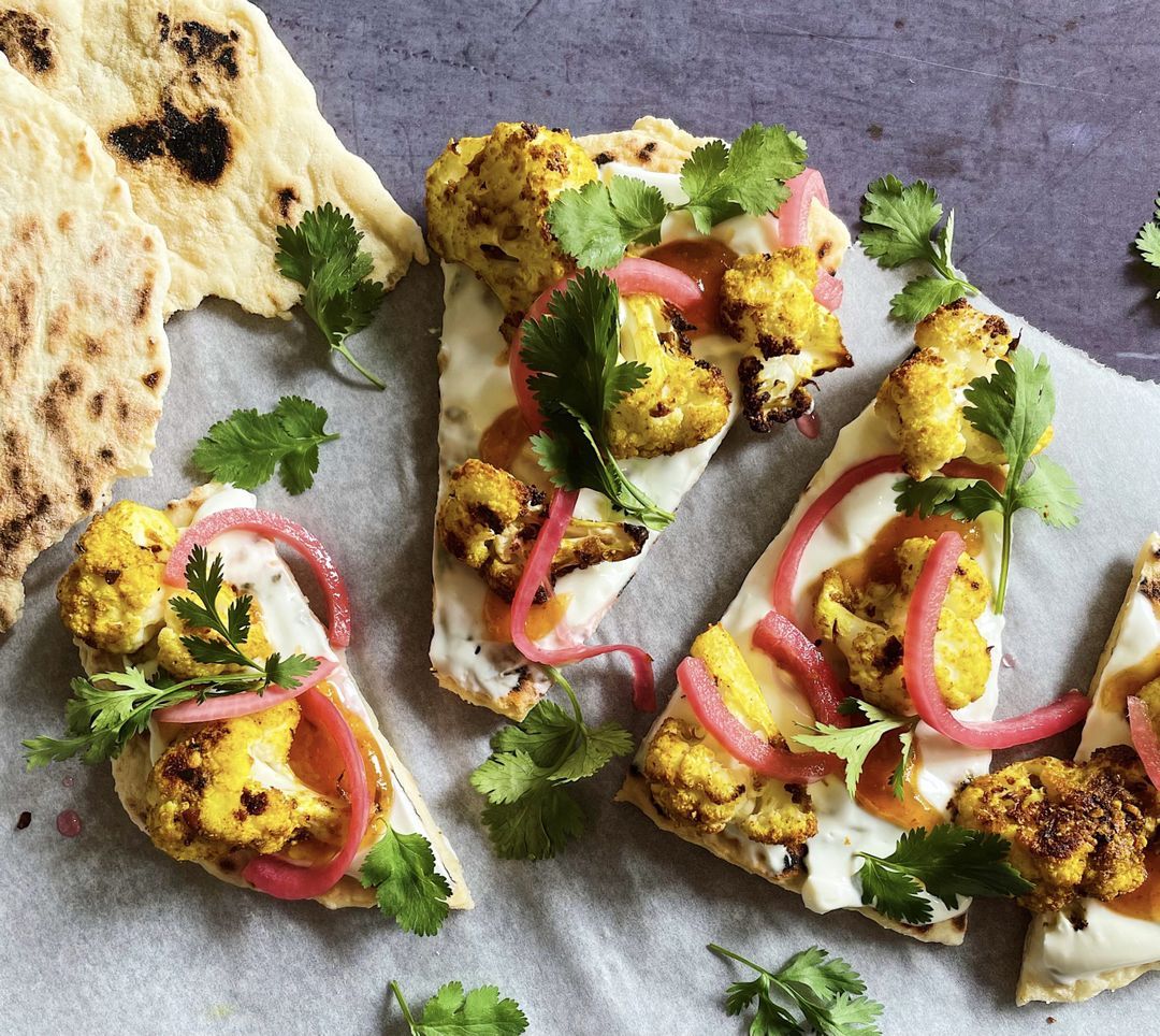 Quick homemade naan bread with curry cauliflower, yogurt and pickled red onion