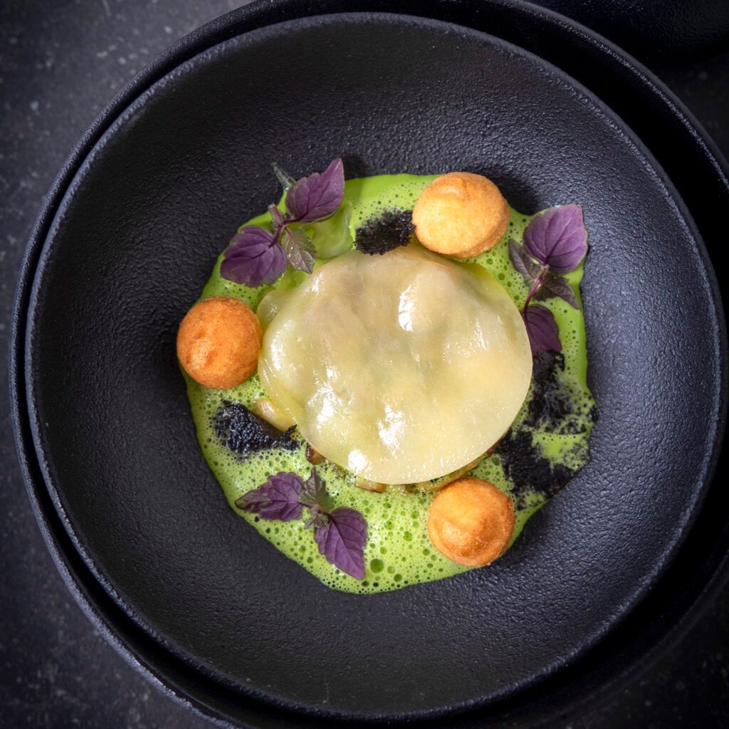 Porcini mushrooms fricassee, Fontina ravioli and parsley sauce