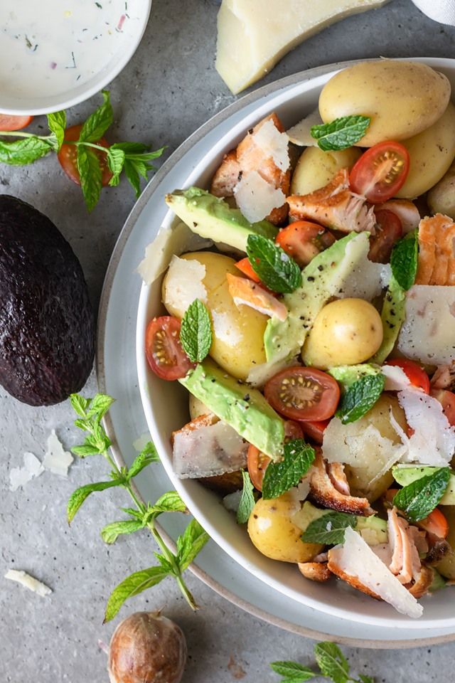 Potato salad with baked salmon, avocado, mint and pecorino