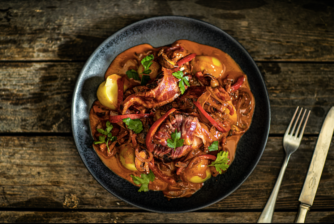 Steak strips in stroganoff sauce with baked potato