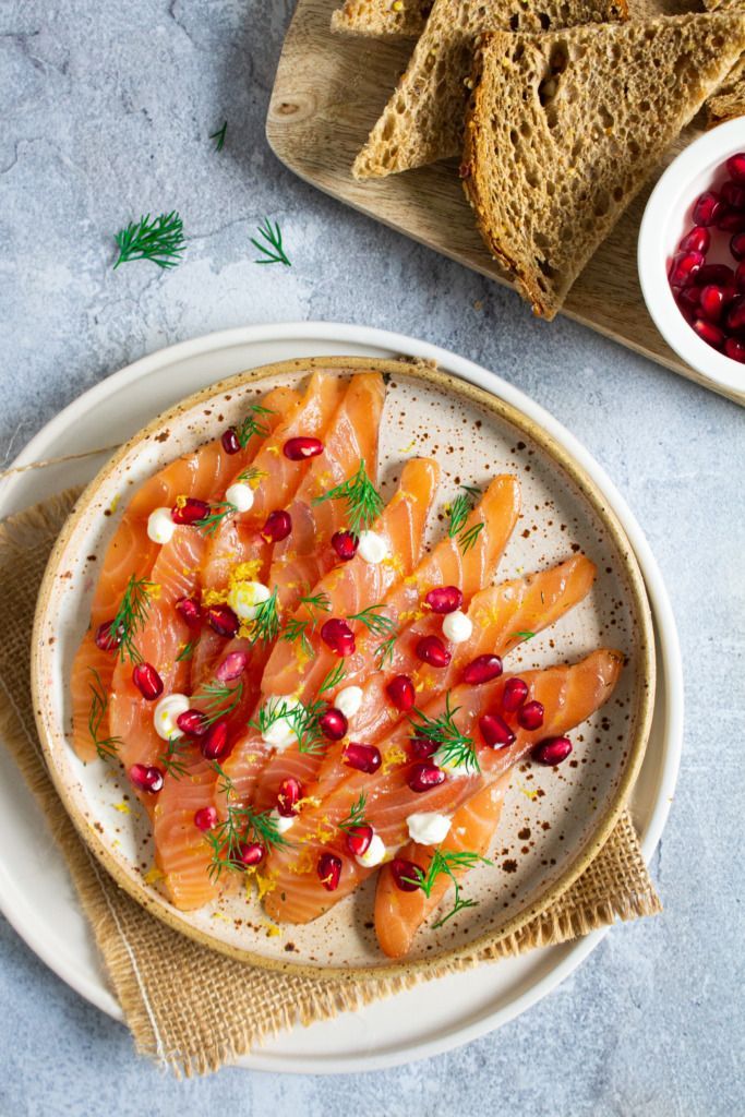 Gravad lax with pomegranate and sour cream