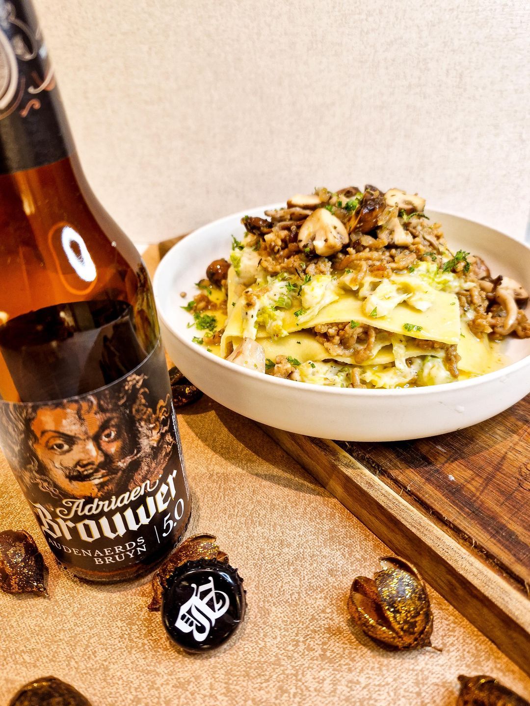 Open lasagna with minced meat in beer sauce, savoy cabbage and mushrooms